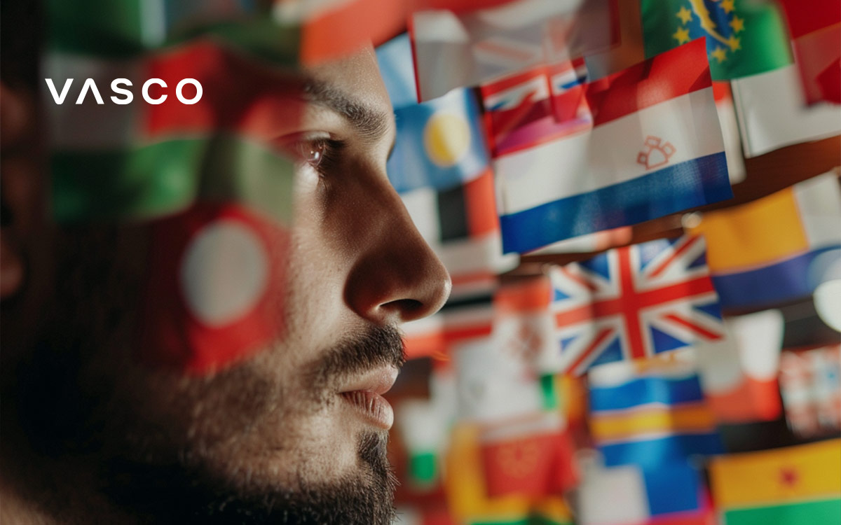 Un homme barbu qui regarde les drapeaux de différents pays